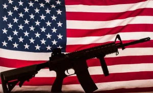 depositphotos_35276891-stock-photo-gun-silhouette-on-american-flag